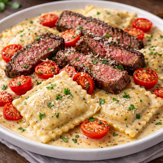 a bowl of ravioli with steak slices and cherry tomatoes 